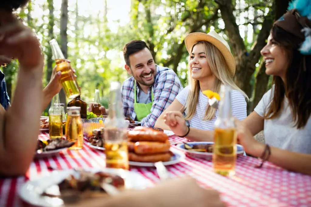 group of happy friends having a barbecue party in nature 1024x682 1